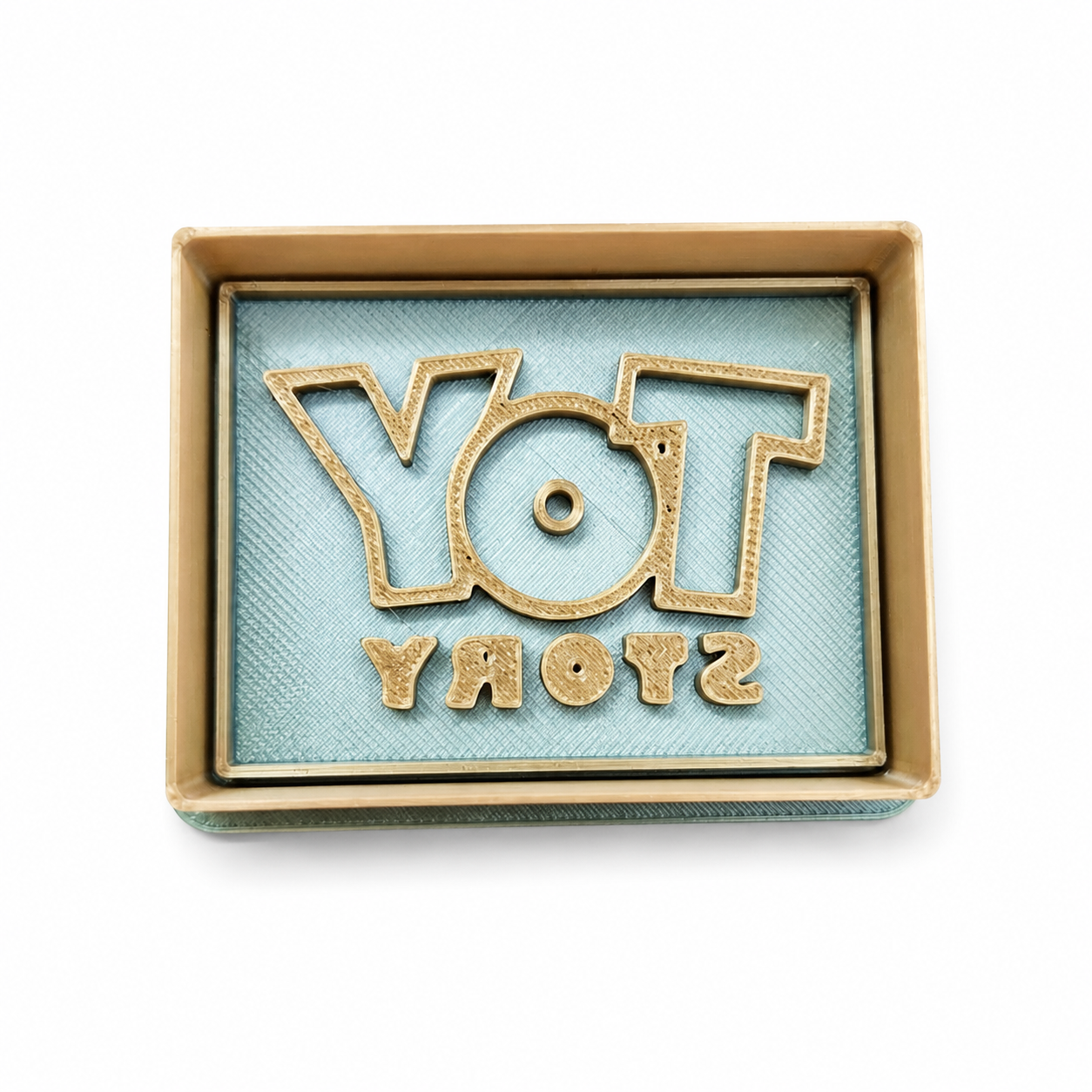 Sprinkley cookie cutters - toy story logo uitsteker met impressie bij cake, bake & love 3 Sprinkley cookie cutters - toy story logo uitsteker met impressie