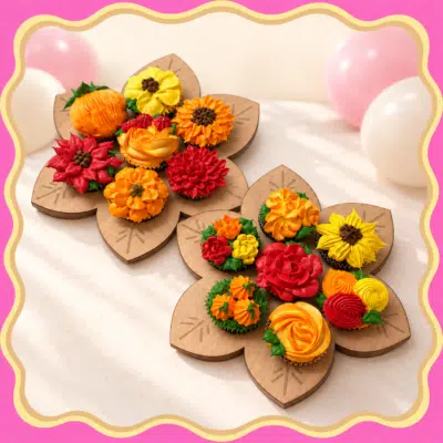 Kleurrijke bloemcupcakes op houten planken Kleurrijke bloemcupcakes op houten planken